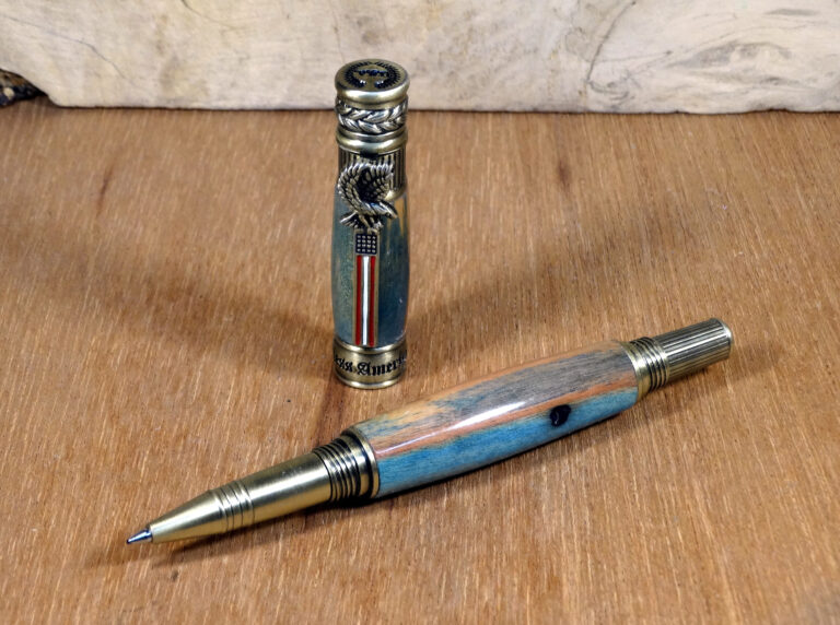 American Patriot rollerball pen in antique pewter with blue-dyed flame box elder.